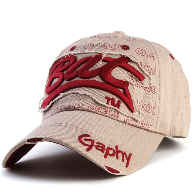 Beige baseball cap with red embroidered letter pattern and curved brim