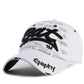 White baseball cap with black embroidered letter pattern and curved brim