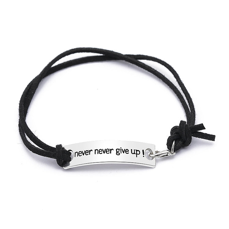 Black cord bracelet with silver bar clasp and “never never give up!” lettering