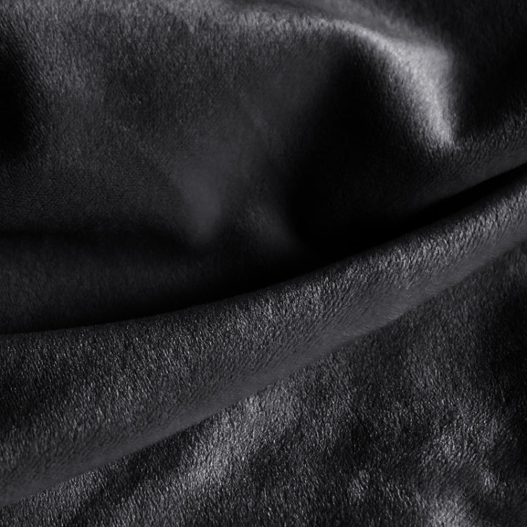 Black plush sofa cover fabric close-up, soft thick pile with visible nap texture