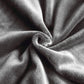 Grey plush sofa cover fabric close-up, soft thick pile with smooth folded texture