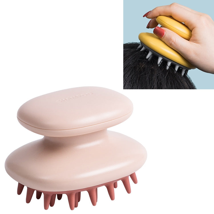 Silicone scalp massage comb with soft rounded head and rubber bristles, light pink