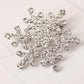 Silver-tone rhinestone snowflake brooch with detailed starburst crystal pattern
