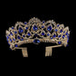 Gold rhinestone tiara crown with blue gem accents and combs