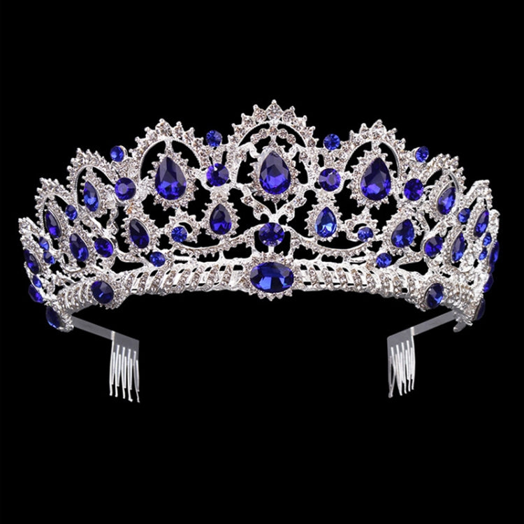 Silver rhinestone tiara crown with blue gem accents and combs