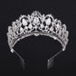 Silver rhinestone tiara crown with ornate cutout details and combs