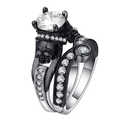Skull ring with white round-cut stones and large clear center gem