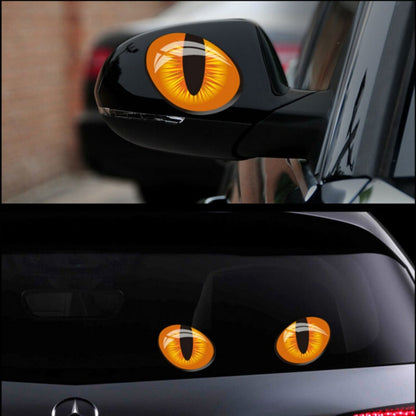 3D cat-eye car sticker set with orange eye decals on a side mirror