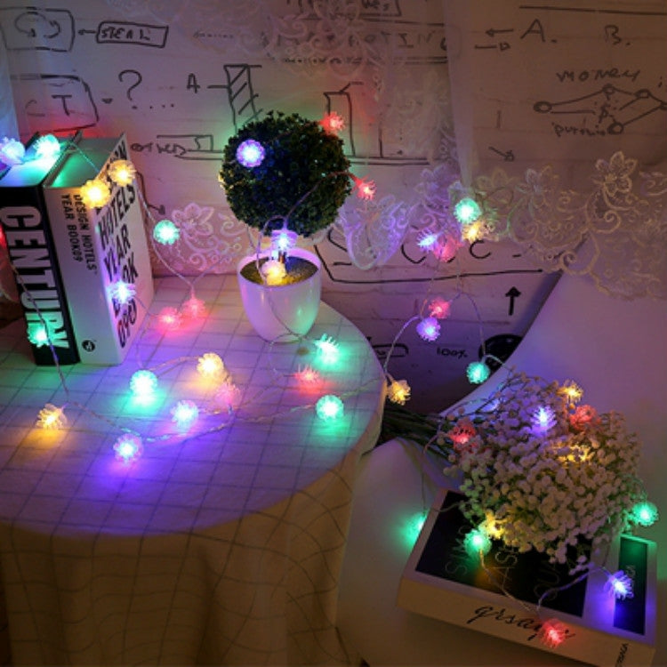 Colorful pine cone LED string lights with warm-white glow, multi-bulb fairy style set