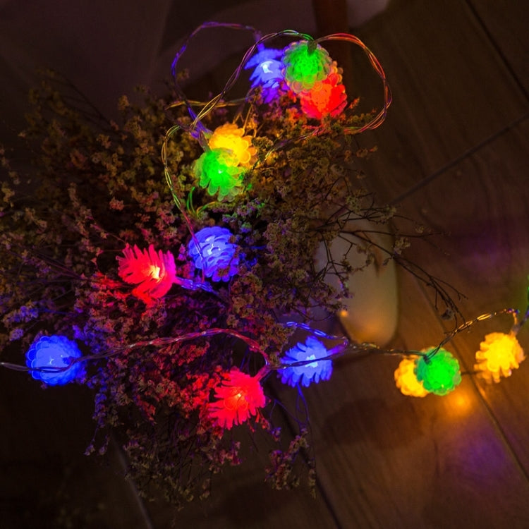 Colorful pine cone LED string lights with rainbow glow bulbs on a connected strand