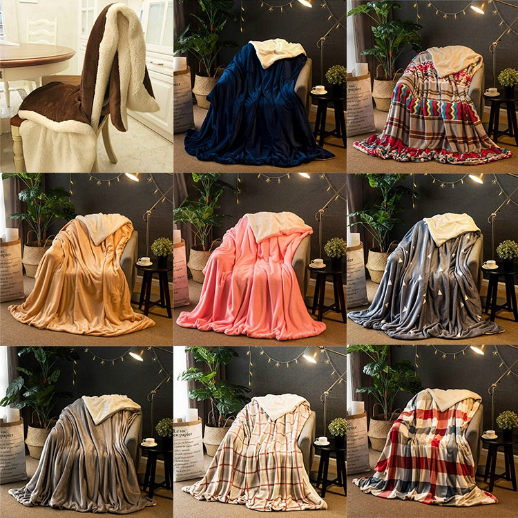 Assorted double-thick sofa blankets in multiple colors, folded and draped