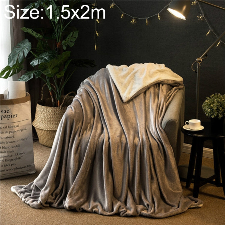 Double-thick sofa blanket in silver gray velvet fleece, folded and draped