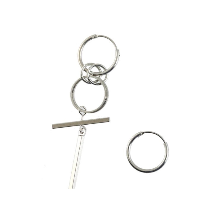Silver-tone long asymmetric earrings with stacked hoop circles and dangling bar.