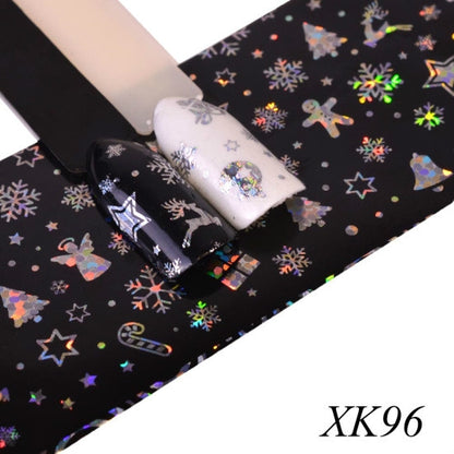 Holographic snowflake nail foil transfer sheet, black background with multicolor flakes