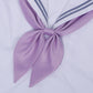 Goldfish-knot bow tie in lavender purple with a centered knot on a white shirt collar.