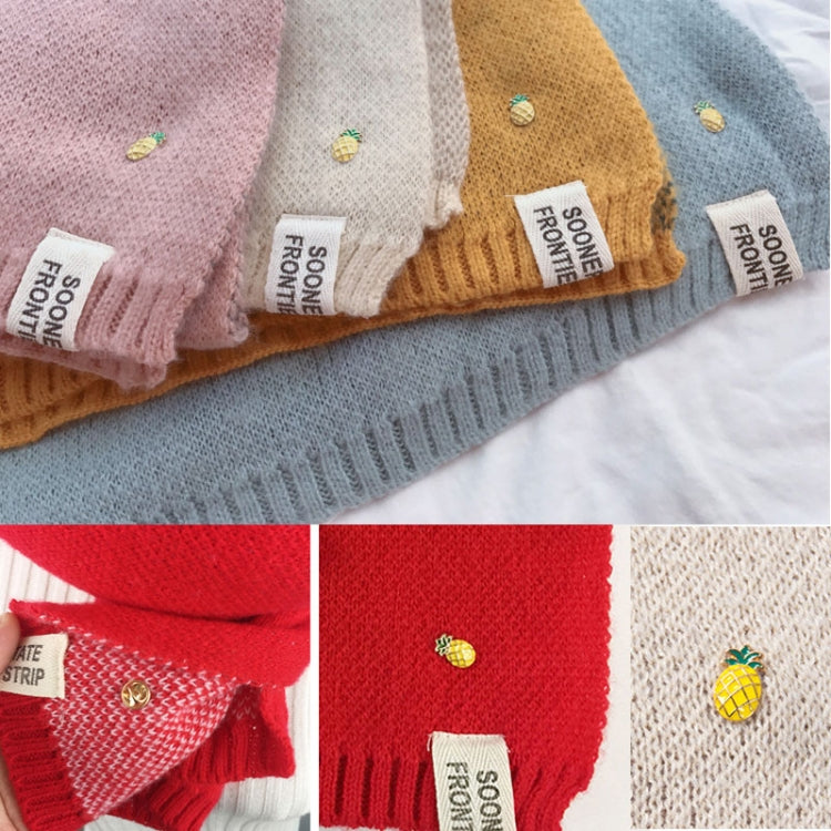 Thick knit scarf ends with embroidered pineapple motifs and woven brand labels, multi-color
