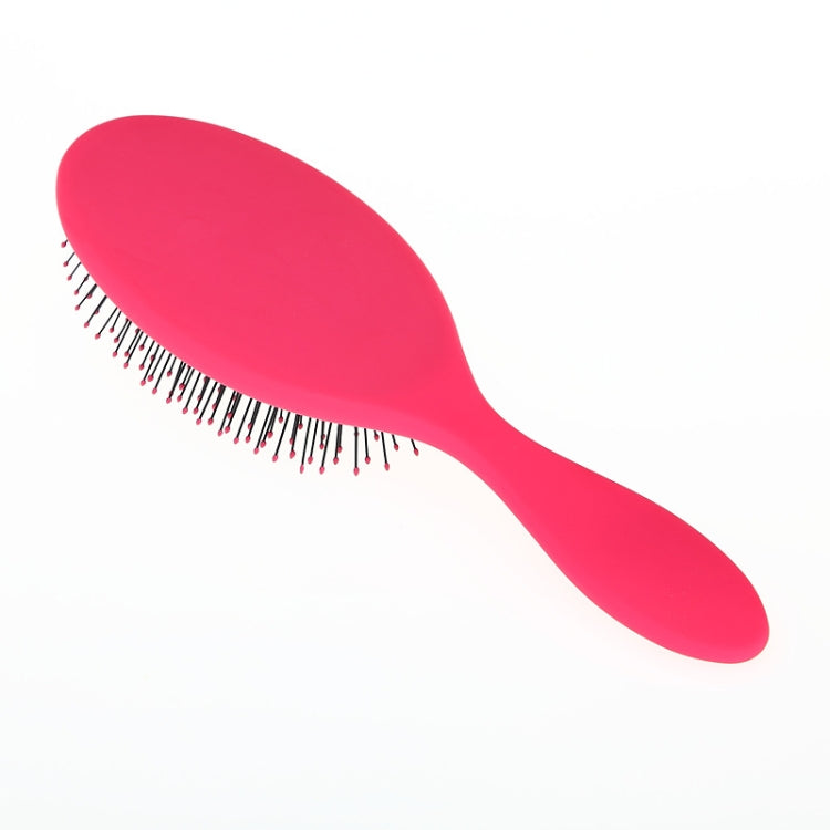 Red hair brush with oval head and fine black bristles for detangling