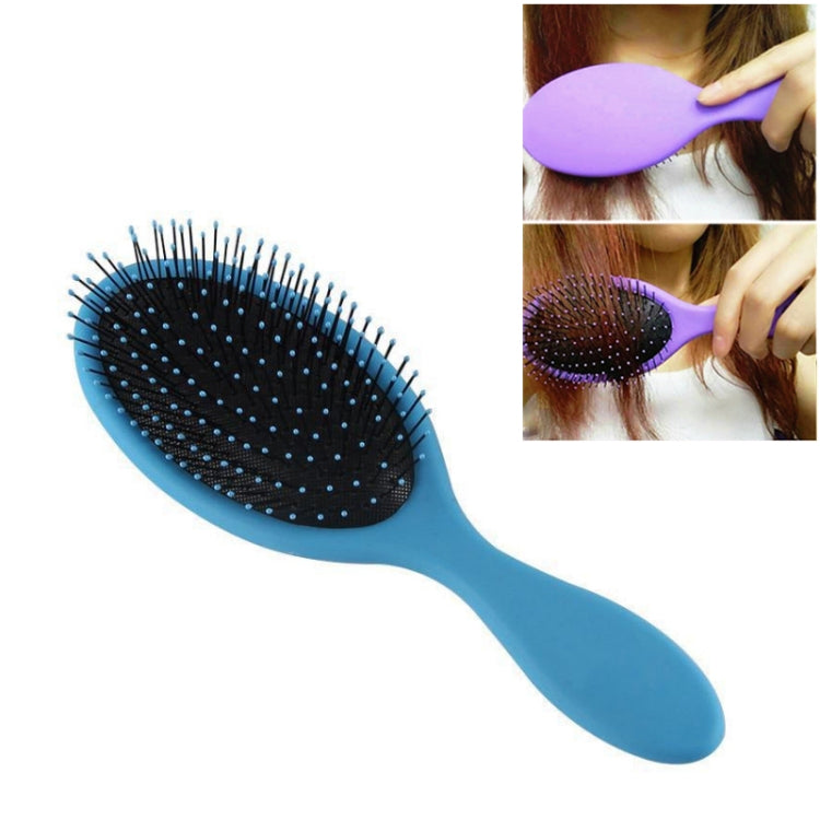 Blue hair brush with oval black bristle pad and long handle