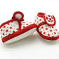 Baby prewalker shoes in red with star pattern and soccer patch, side view
