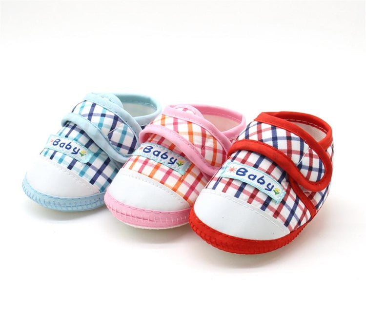 Baby prewalker shoes with plaid uppers, “Baby” label, and soft cushioned sole