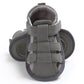 Grey toddler canvas sandals, front view with Velcro straps and soft padded lining