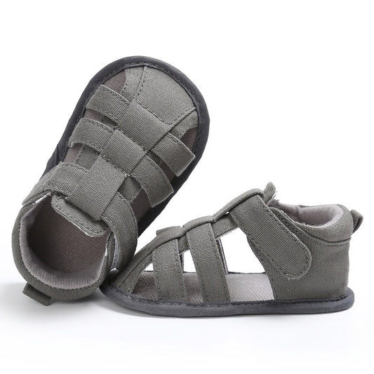 Grey toddler canvas sandals with crisscross Velcro straps and cushioned interior