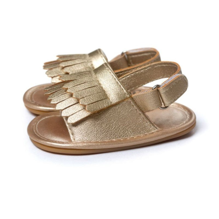 Gold-toned fringed toddler sandals with wide strap and hook-and-loop closure