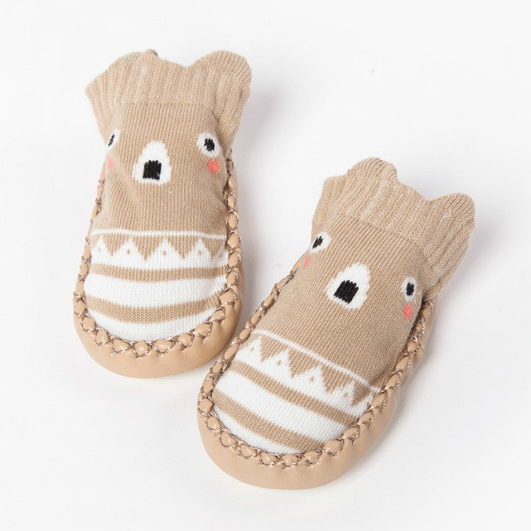 Tan knit baby floor socks with animal face motif, striped band, non-slip sole