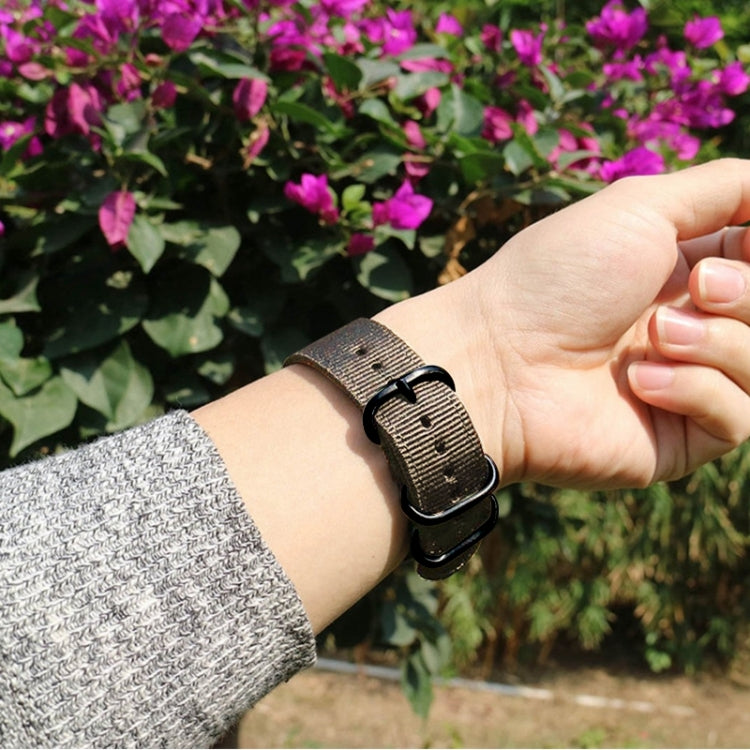 Washable nylon canvas watch band in dark brown with black ring buckle on wrist.