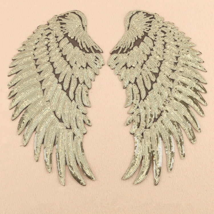 Pair of silver sequin feather wing patches, wing-shaped with scalloped edges