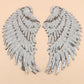 Pair of white sequin feather wing patches with detailed feather texture