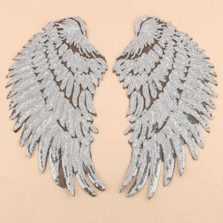 Pair of white sequin feather wing patches with detailed feather texture