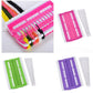Pink cross-stitch organizer tool with multiple floss colors and white template strip