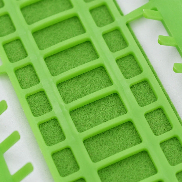 Green cross-stitch thread organizer tool with textured grid and slot openings