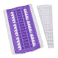 Purple cross-stitch thread organizer tool with slotted grid and white template strip