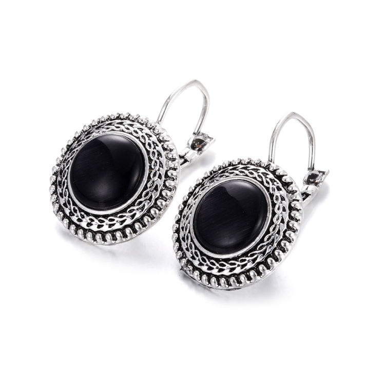 Boho drop earrings with round black cabochon in ornate silver filigree frames, hoop hooks