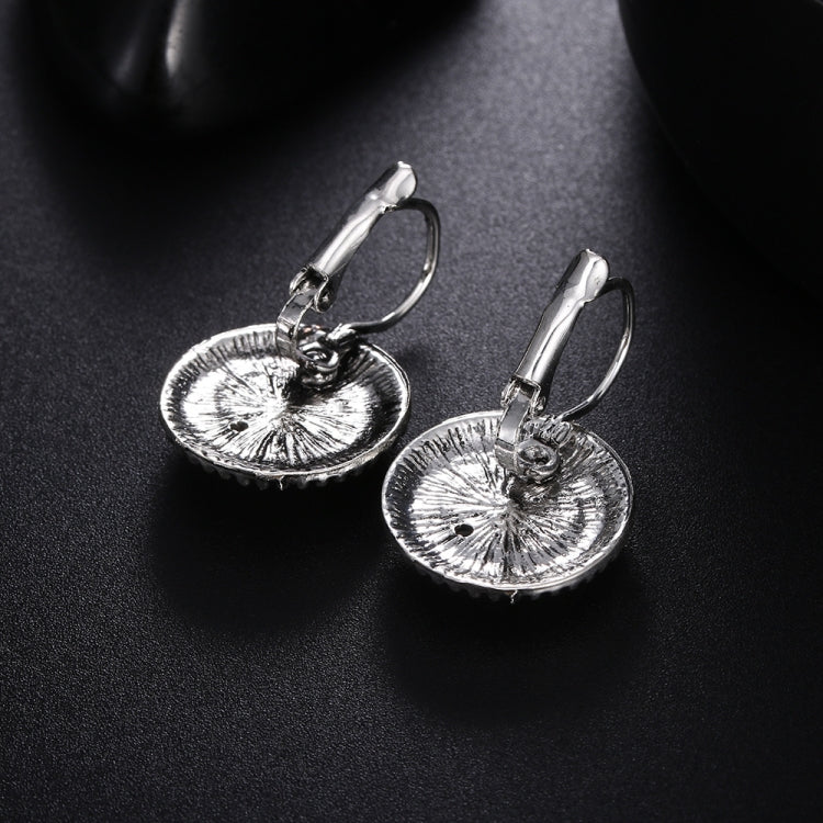 Round drop earrings with textured silver disc centers and hinged hoop hooks
