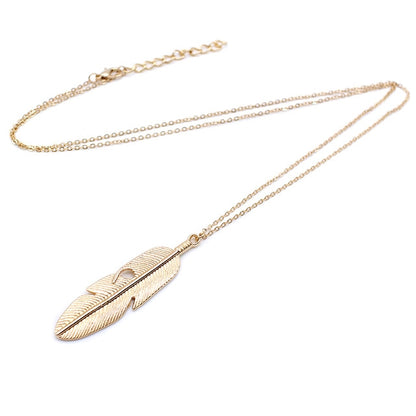 Gold feather pendant long chain necklace with leaf-textured feather charm
