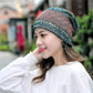 Teal and rust patterned cotton wrap turban hat with side gather
