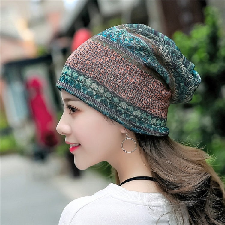 Teal patterned cotton wrap turban hat with side knot and folded edge