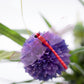 Purple dragonfly decoration with translucent wings and stick handle