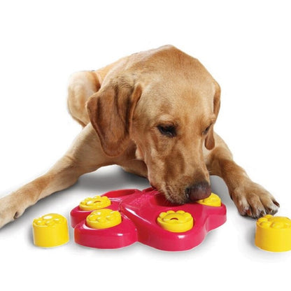 Red slow feeder pet bowl with six puzzle cups and yellow smiling paw pieces
