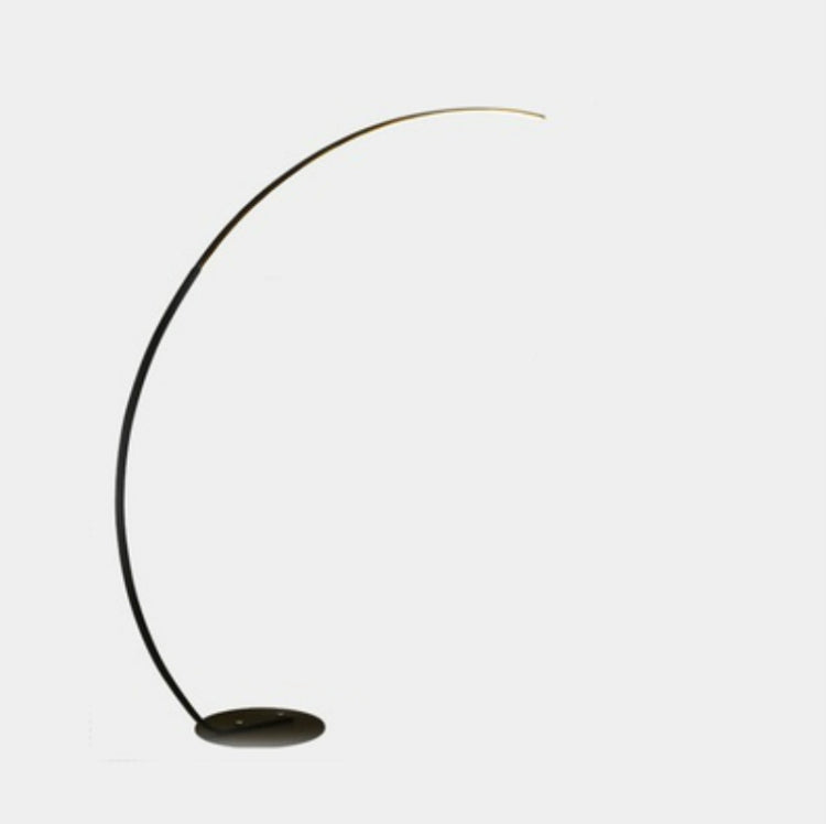 Black and gold curved arc floor lamp with flat round base
