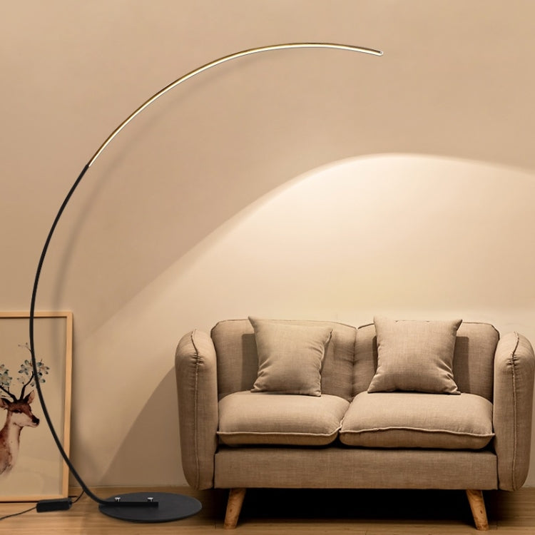 Black arc floor lamp with curved light strip and round base