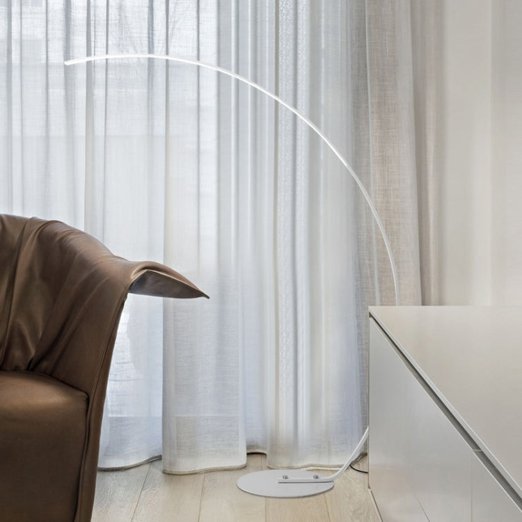 Curved arc LED floor lamp with white light bar and round base