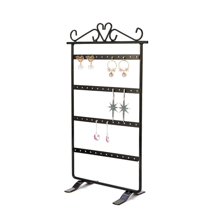 Black jewelry stand display with top earring hooks and multiple dangling earrings shown.