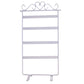 White jewelry stand holder rack with four tier bars and curved earring hooks on top.