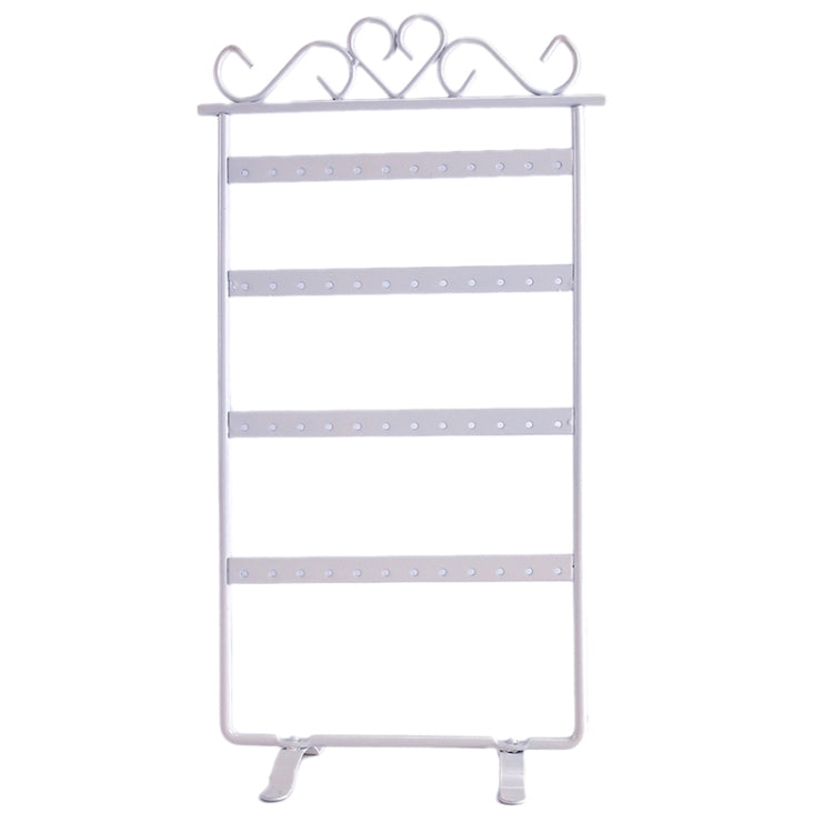 White jewelry stand holder rack with four tier bars and curved earring hooks on top.