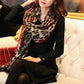 Leopard-print heart-pattern scarf shawl with red trim, wrapped on model