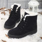 Ladies black lace-up snow boots with white faux-fur trim and rubber sole